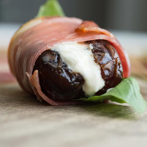 Read more about the article Grilled Chevre-Stuffed Dates Wrapped in Serrano Ham Recipe